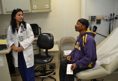 Durham VAMC Dr. Fawzia Salahuddin consults Veteran Leslie Morgan during his visit to the Mobile Medical Unit in Tarboro, N.C. 
