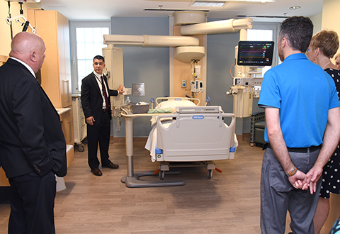 Salisbury VAHCS Intensive Care Unit Director Dr. Ravi Agarwala shows off one of the new patient care rooms to visitors