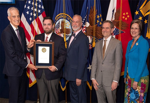 Photo of Army Veteran Robert Acevedo receiving the Secretary’s Award for Excellence in Nursing from Secretary Denis McDonough